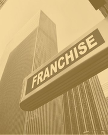 Franchise signage beside a city skyscraper