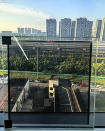 Transparent solar photovoltaic glass on a building balcony